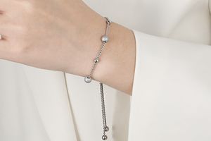 Zilverkleurige armband met balletjes en luxe treksluiting